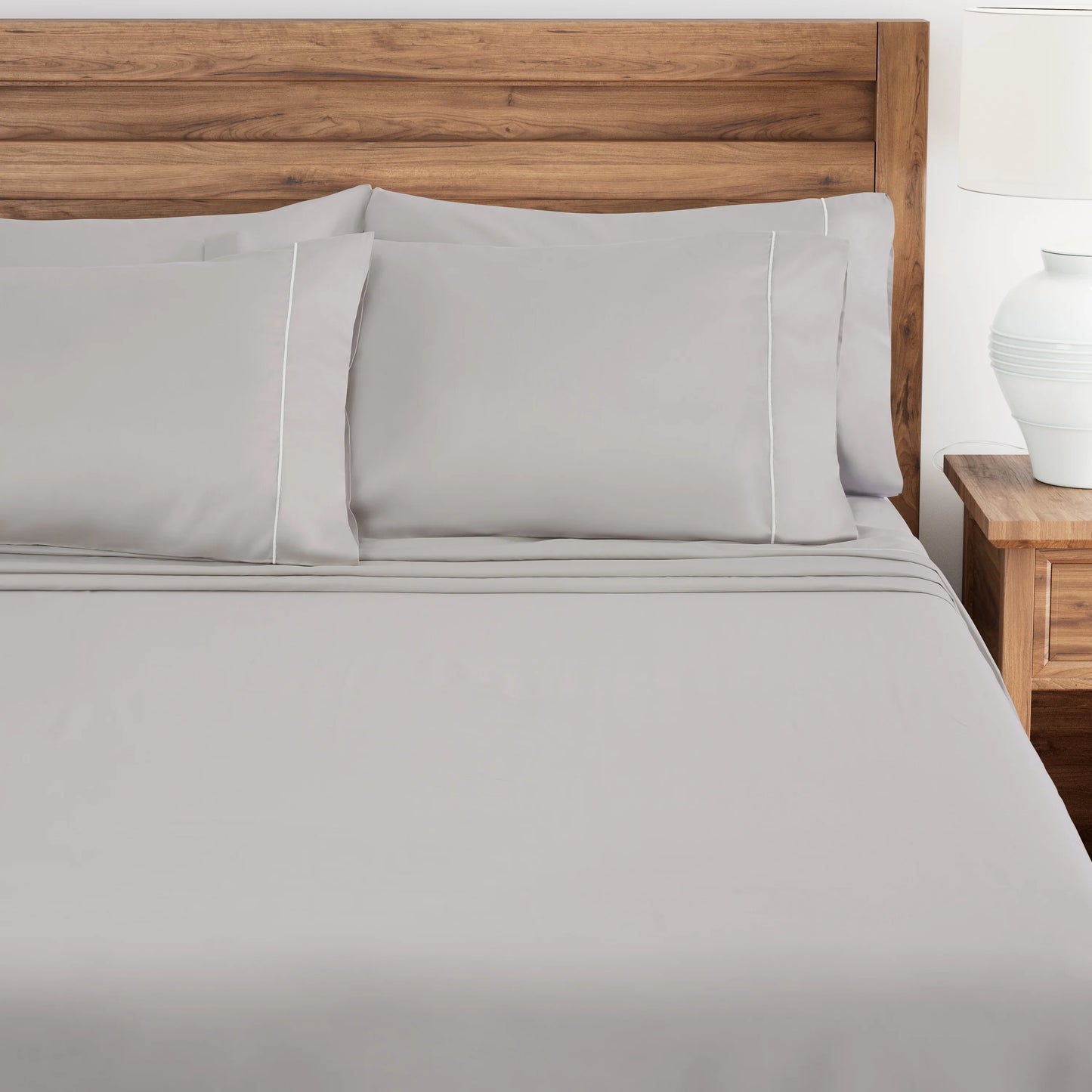 Lunar Rock bedding set on a bed with a wooden headboard