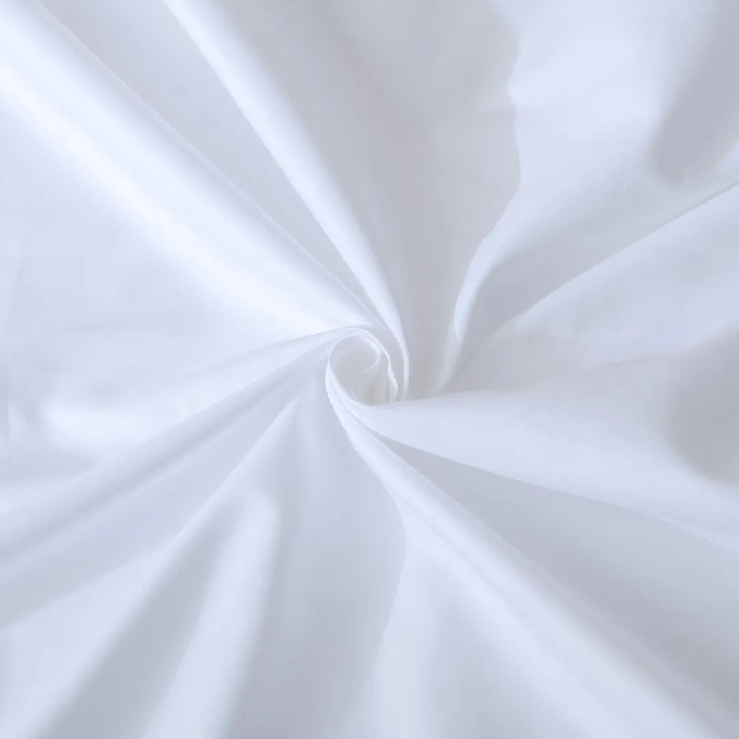 Close-up of white sateen fabric with a swirl pattern