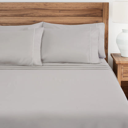 Lunar Rock bedding set on a bed with a wooden headboard