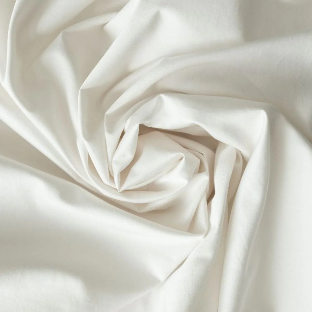 Close-up of white percale fabric with folds